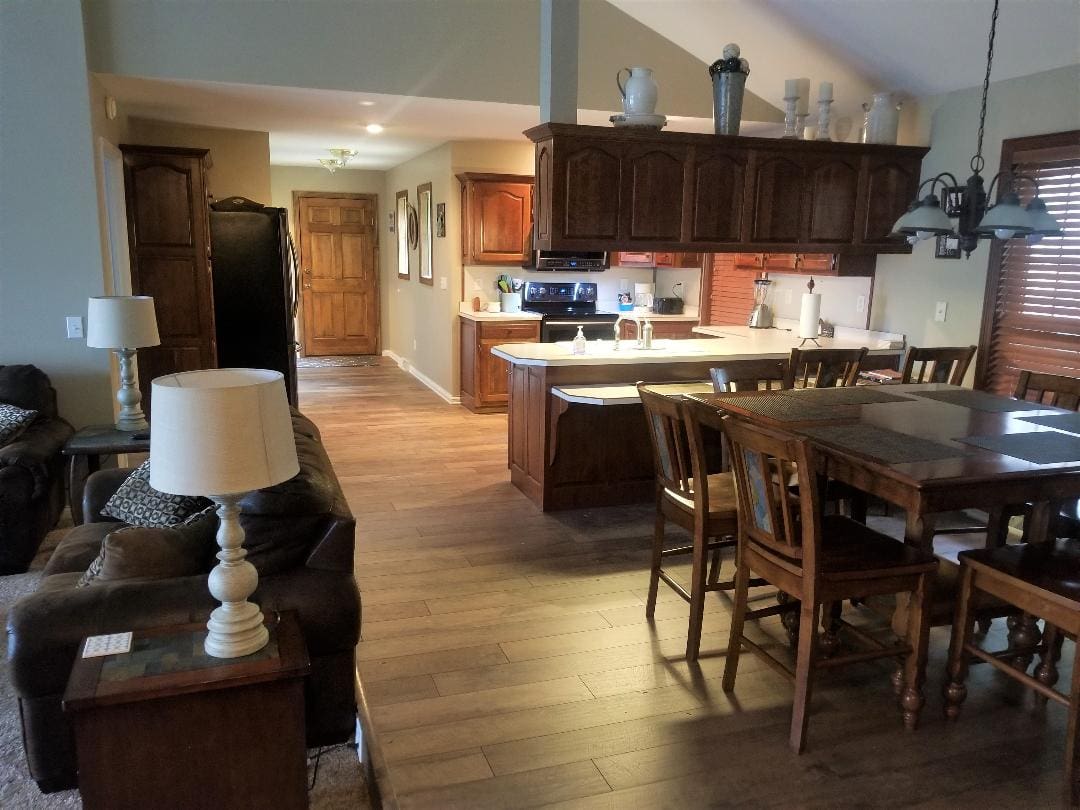 A living room with a dining table and chairs.