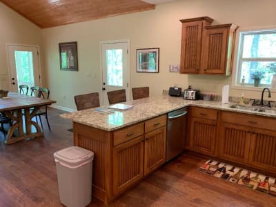 A kitchen with wooden cabinets and counter tops.