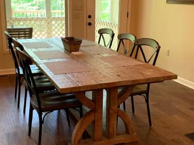 A table with chairs in a room.