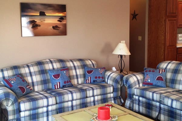 A living room with two couches and a coffee table.