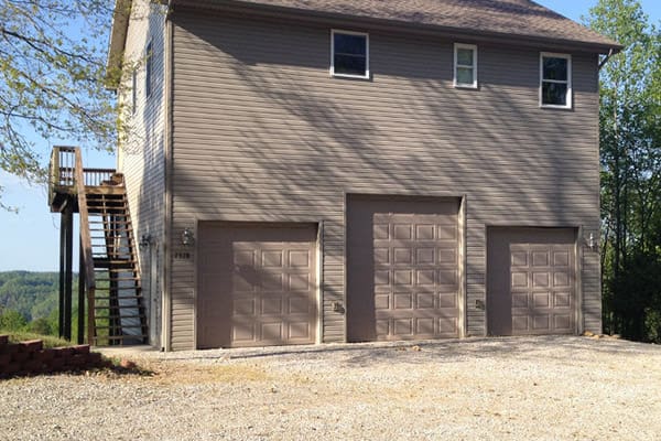 A house with two garages and a staircase.