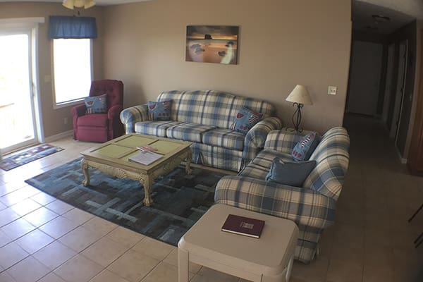 A living room with two couches and a coffee table.