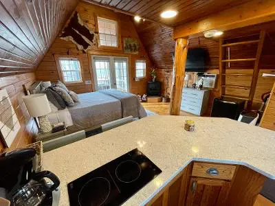 A cabin with a kitchen and living room.