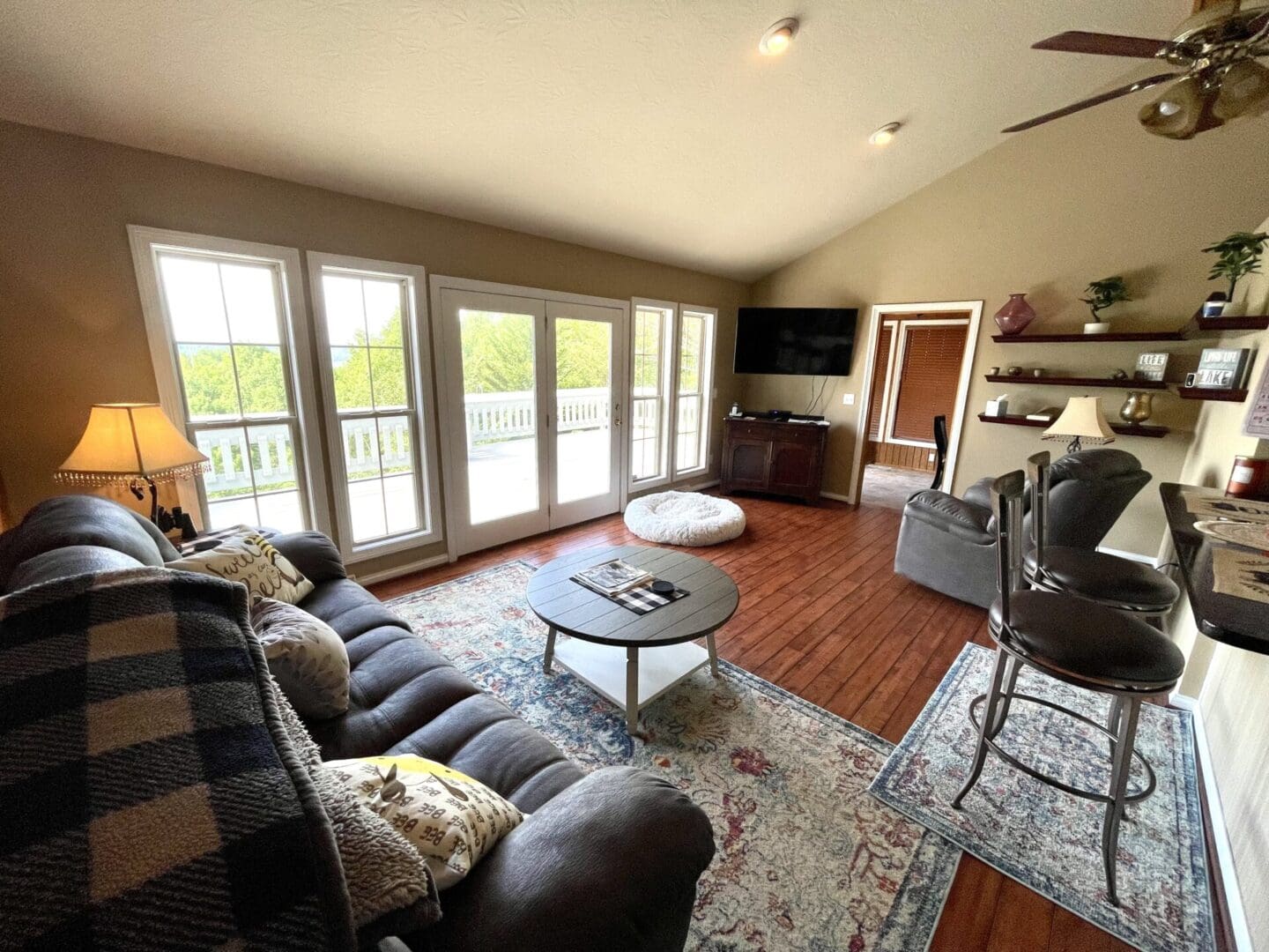 A living room with a fireplace and sliding glass doors.