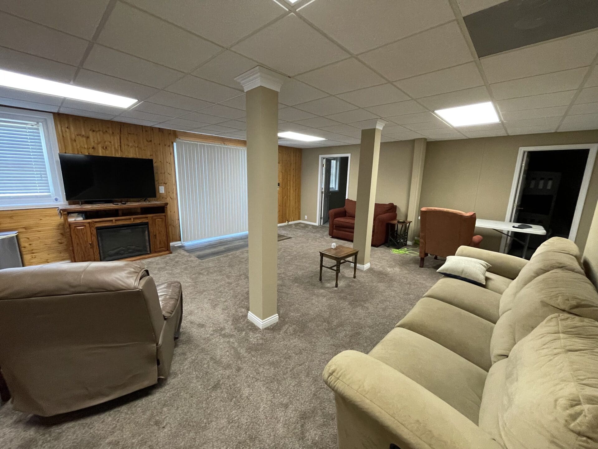 A living room with couches and a tv.