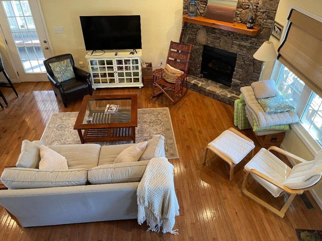 An aerial view of a living room with a fireplace.